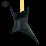 Black electric guitar body with a visible brand logo on a black background