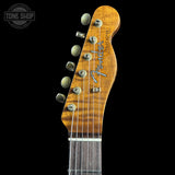 Fender guitar headstock on a black background with 'Tone Shop' logo.