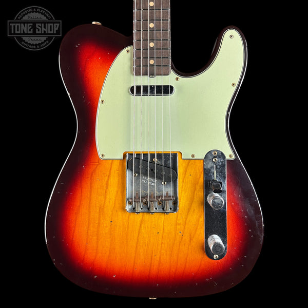 Electric guitar with a sunburst finish on a black background, featuring the Tone Shop logo.