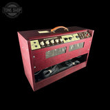 A vintage-style Magnatone amplifier head with a textured red cabinet, cream control panel, and orange handle, shown on a black background with a Tone Shop watermark.