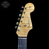 Fender guitar headstock on a black background with 'Tone Shop' logo.