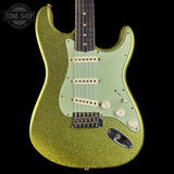 Green glitter electric guitar on a black background with 'Tone Shop' logo.