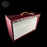 A vintage-style Magnatone guitar amplifier head with a dark red wood finish, white front grille cloth, and an orange-brown leather handle, shown on a black background with a Tone Shop watermark in the upper left.