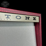 Front detail of Magnatone TSG Exclusive Twilighter Stereo Red Croc/White 2X12 Tube Amp Combo.