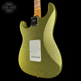 Green glittery electric guitar body with a visible brand logo on a black background