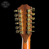 Close-up of a guitar headstock with 12 tuning pegs on a black background, featuring the Tone Shop logo.