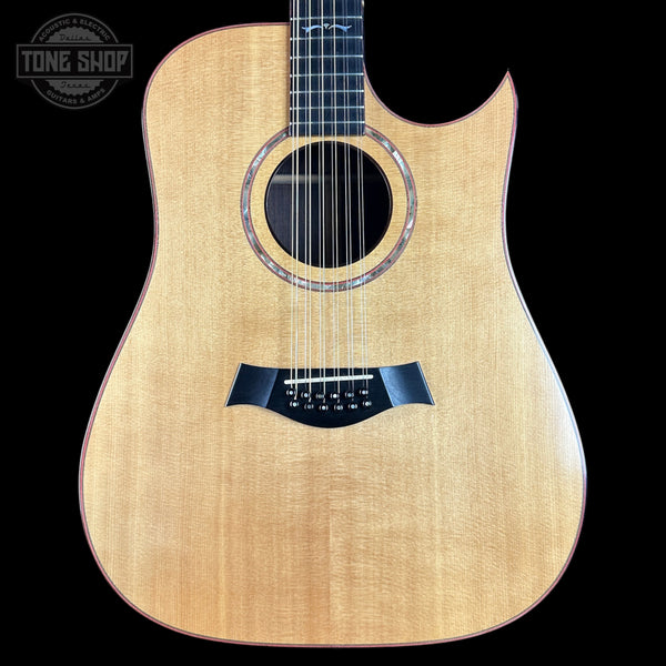 Acoustic guitar with a visible brand logo in the corner
