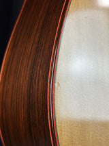 Close-up of a guitar's soundboard with wood grain texture