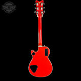 Red electric guitar on a black background with 'Tone Shop' logo.