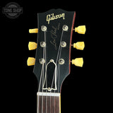 Gibson Les Paul guitar headstock with brand logo on a black background