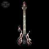 Electric bass guitar with flame design on a black background, featuring the Tone Shop logo.