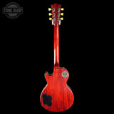 Red electric guitar on a black background with 'Tone Shop' logo.