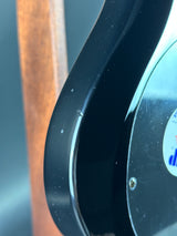 Close-up of a black metallic object with a reflective surface