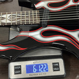 Guitar with flame pattern on a digital scale displaying weight