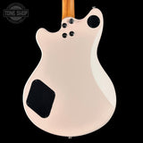 Back of a guitar with a 'Tone Shop' logo in the corner