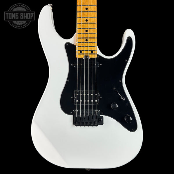 White electric guitar with a black pickguard on a black background, featuring 'Tone Shop' branding.
