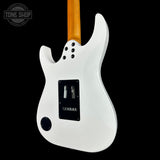 White electric guitar body with a visible brand logo on a black background