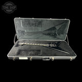 Guitar case with a guitar inside, branded 'Tone Shop'.