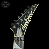 Jackson guitar headstock on a black background with 'Tone Shop' logo.