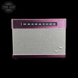 A vintage-style Magnatone guitar amplifier speaker cabinet shown against a solid black background. The cabinet features a textured magenta-purple front baffle, a silver-gray woven fabric grille, and a matching purple top border with the 'MAGNATONE' brand name in white lettering.