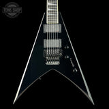 Black electric guitar with a unique neck design on a black background, featuring the 'Tone Shop' logo.