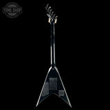Black electric guitar on a black background with 'Tone Shop' logo.