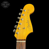 Guitar headstock with Fender Jazzmaster logo on a black background