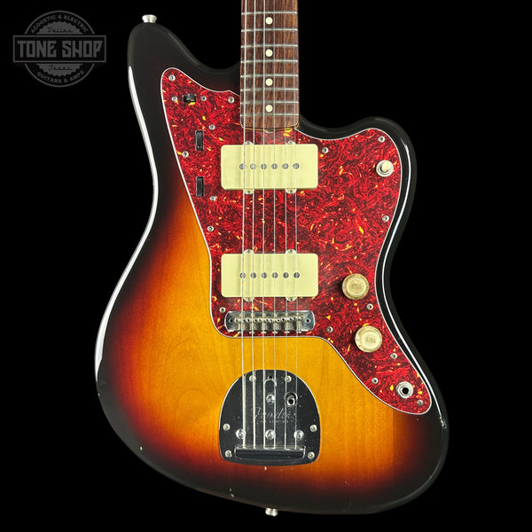 Electric guitar with a sunburst finish and red flamed maple top on a black background, featuring 'Tone Shop' branding.
