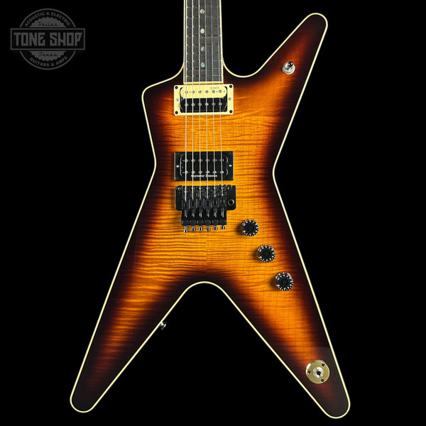 Electric guitar with a sunburst finish on a black background, featuring the Tone Shop logo.