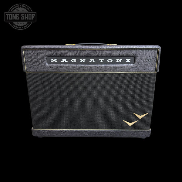A vintage-style Magnatone guitar amplifier head against a solid black background, featuring a black textured grille, a black top panel with gold trim and the white 'MAGNATONE' logo, and a gold bird logo in the lower right corner.