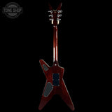 Electric guitar with a dark finish on a black background, featuring the 'Tone Shop' logo.