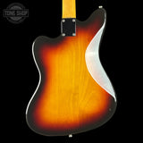 Electric guitar with sunburst finish on a black background, featuring 'Tone Shop' logo.