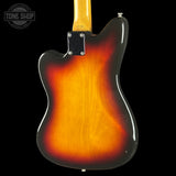 Back view of a sunburst electric guitar with 'Tone Shop' logo.