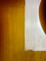Close-up of a wooden surface with a white strip running horizontally.