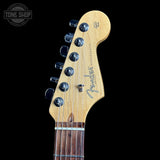 Fender guitar headstock on a black background with 'Tone Shop' logo.