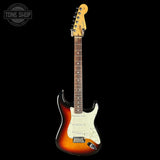 Electric guitar with a sunburst finish on a black background, featuring the Tone Shop logo.