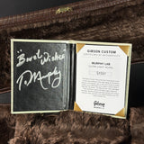 Gibson Custom certificate of authenticity on a textured surface