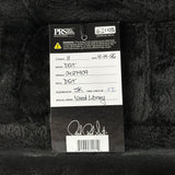 A PRS Guitar brand hangtag for a DGT bass neck, showing handwritten details and a signature, placed on a black furry surface.
