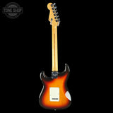Electric guitar with sunburst finish on a black background, featuring the Tone Shop logo.