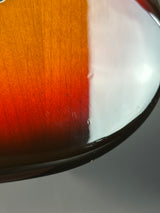 Close-up of a glass with a gradient of red and white liquid.