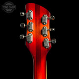 Close-up of a red electric guitar's headstock on a black background with 'Tone Shop' logo.