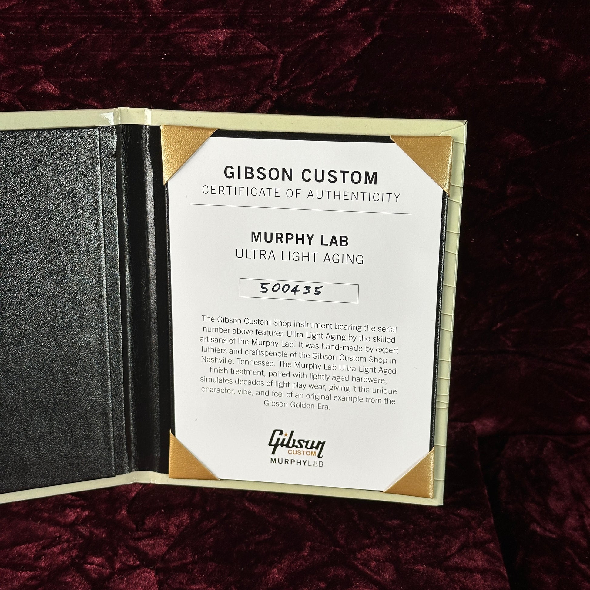 Gibson Custom Certificate of Authenticity on a dark textured surface