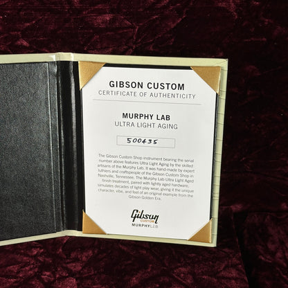 Gibson Custom Certificate of Authenticity on a dark textured surface