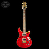 A red electric guitar with a vibrant red flame finish, gold hardware, and a maple neck, shown against a solid black background with a Tone Shop watermark in the top left corner.