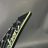 Fender guitar headstock with 'Made in USA' text on a gray background