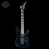 Black electric guitar on a black background with 'Tone Shop' logo.