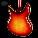 Glossy red electric guitar body with a visible brand logo in the corner.