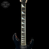 Close-up of a guitar neck with a black body on a black background, featuring the 'Tone Shop' logo.