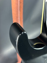 Close-up of a car's black rearview mirror with a blurred background