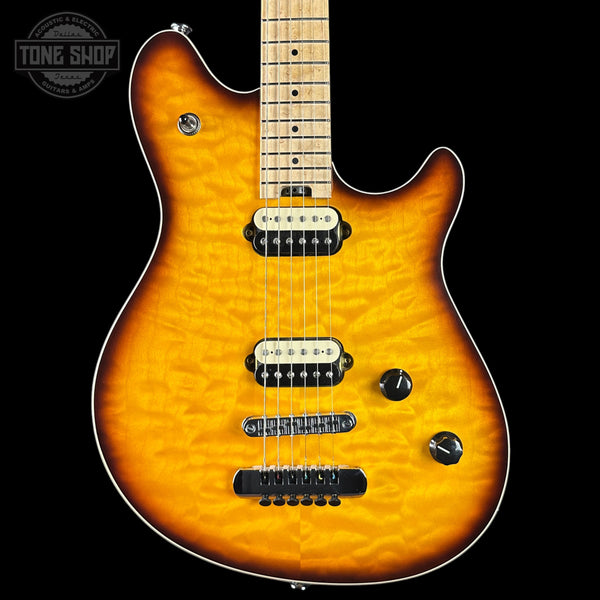 Electric guitar with a sunburst finish on a black background, featuring the Tone Shop logo.